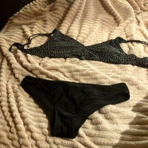 Small bathing suit bottoms along with medium sized top from